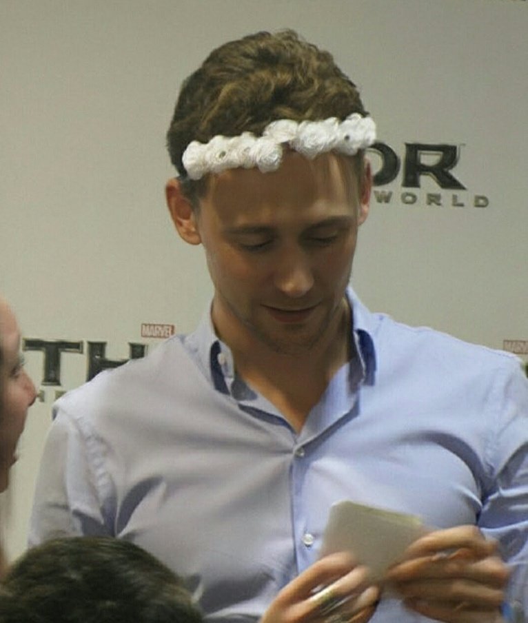 bestoftwh's tweet photo. tom hiddleston with a wreath.🌼 https://t.co/t2xyIl9Bag