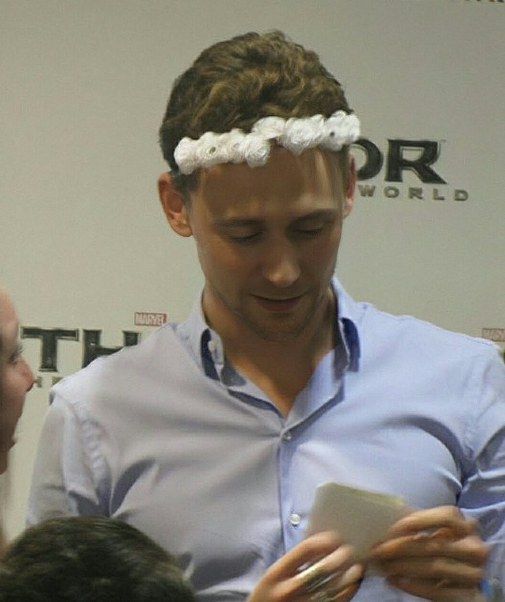 bestoftwh's tweet photo. tom hiddleston with a wreath.🌼 https://t.co/t2xyIl9Bag