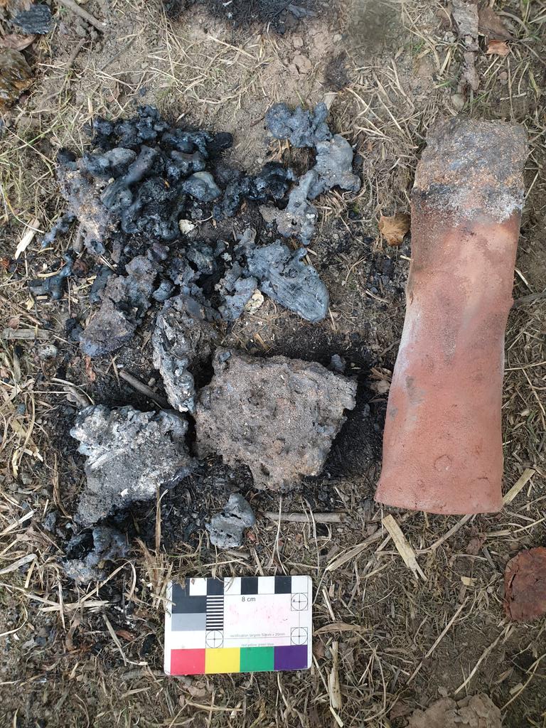 Righ_Gobha's tweet photo. And the results of my experimental archaeology! Proof that peat works as an iron smelting fuel! It was a short smelt at just 3 hours but it produced a 'bloom' (the larger pieces to the left of the clay tùyere) with some metallic iron, and plenty of slags to analyse. https://t.co/fGwIg6sOW9