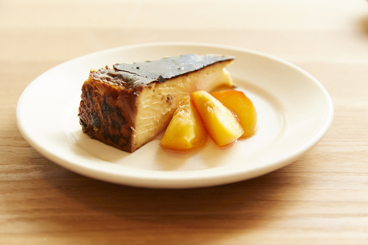 Wood-oven Basque cheesecake by <a href="/elliotslondon/">Elliot's</a>.   blog.resy.com/2021/08/the-ne…