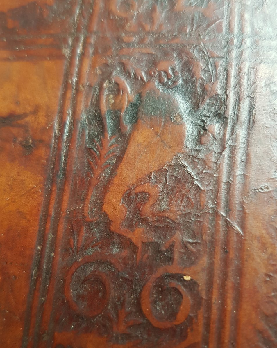 EtonCollLibrary's tweet photo. He might not be the most majestic of lions, but this little fellow has been guarding this book for 500 years! Can you make him out? This blind-rolled lion perches on the initials 'G.G': Garrett Godfrey, the Cambridge bookbinder.

https://t.co/DWTrXl6RdZ

#WorldLionDay #rarebooks https://t.co/QfsvnSqNQT