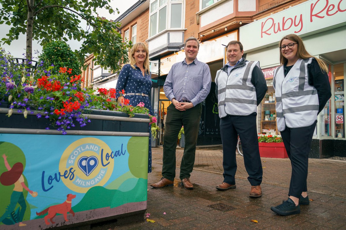 milngavie's tweet photo. £10m #ScotlandLovesLocal fund launched yesterday in rainy #Milngavie with @DamonScott1550 @phil_prentice &amp; @ThomasCArthur. Pleased to showcase on-street branding, aligned with digital work by @milngaviebid team and intro local businesses. #ChooseLocal https://t.co/ktJjFY7tos https://t.co/GDJAEo5mOu