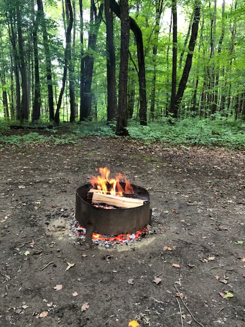 TrinityHS's tweet photo. This simple prayer fire signifies so much to the THS family. It is a clear sign that our renowned Retreats are back in full force, including #GotPrayer for @doccathschools 8th graders all over @DIOCESEofCLE. Soon this fire at Pymatuning State Park will be surrounded by our (1/2) https://t.co/rq5I0CkqjH