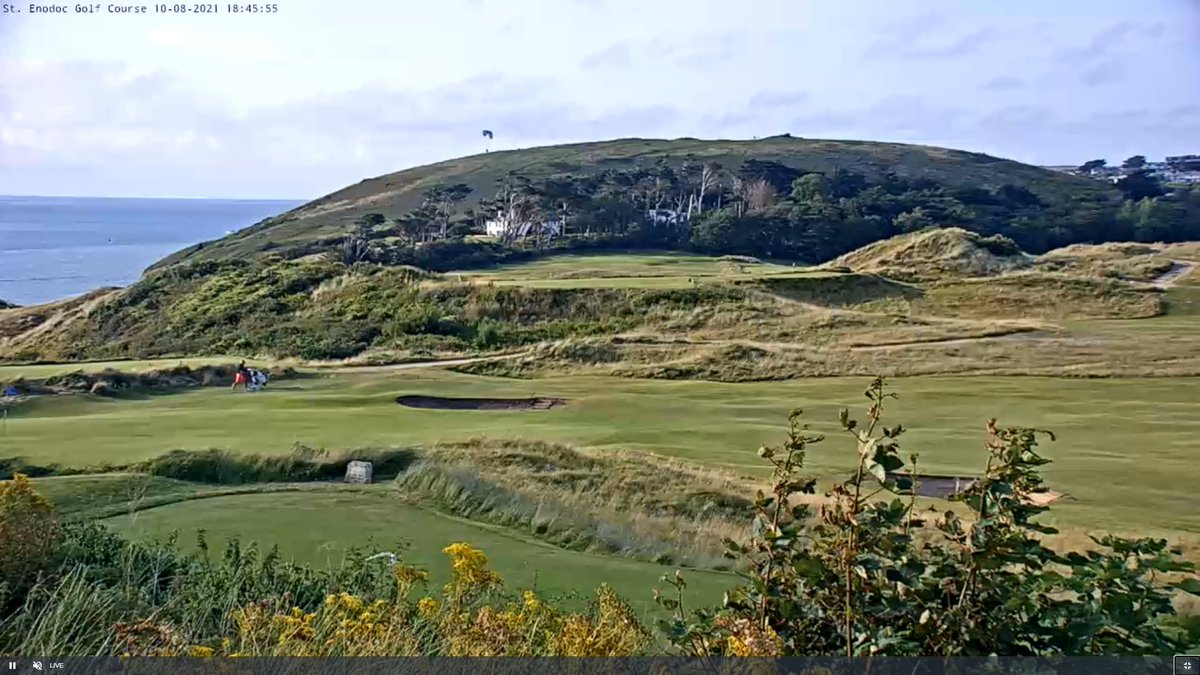 Early evening, looking across the 7th green, towards the 9th green, Brea Hill and a para-glider !