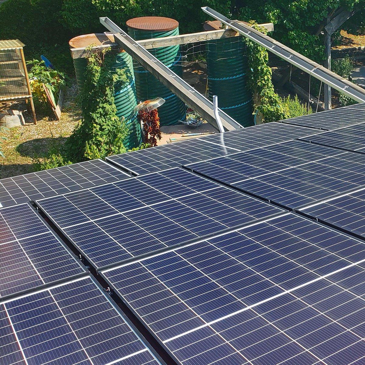 PositiveESolar's tweet photo. Solar, garden, and water collection — oh my!  🌞 + 🪴 +💧
.
.
.
#GeneratePositiveEnergy #solarenergy #newmexico #sustainableliving #solarpanels #NMsolar #renewableenergy #climateaction #sustainability #gardening https://t.co/SQSKuk06Ck