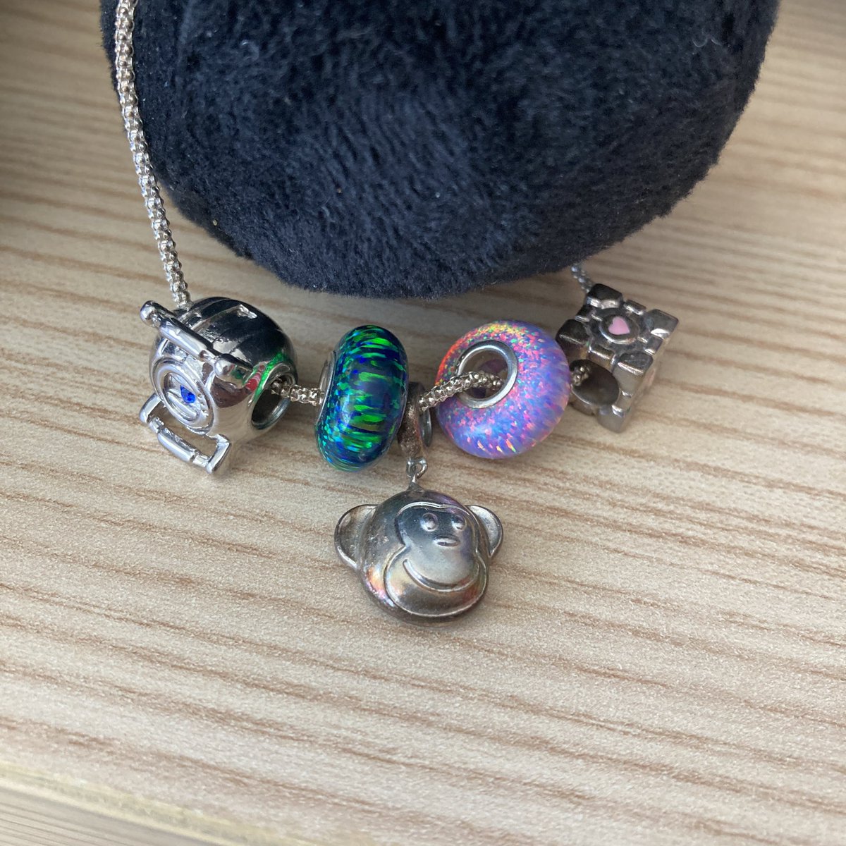 LayliaParker's tweet image. Doing some cleaning and found my old #thinkgeek charm bracelet. 💖