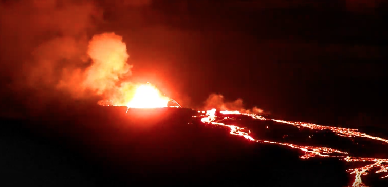 lava flowing down the volcano at night