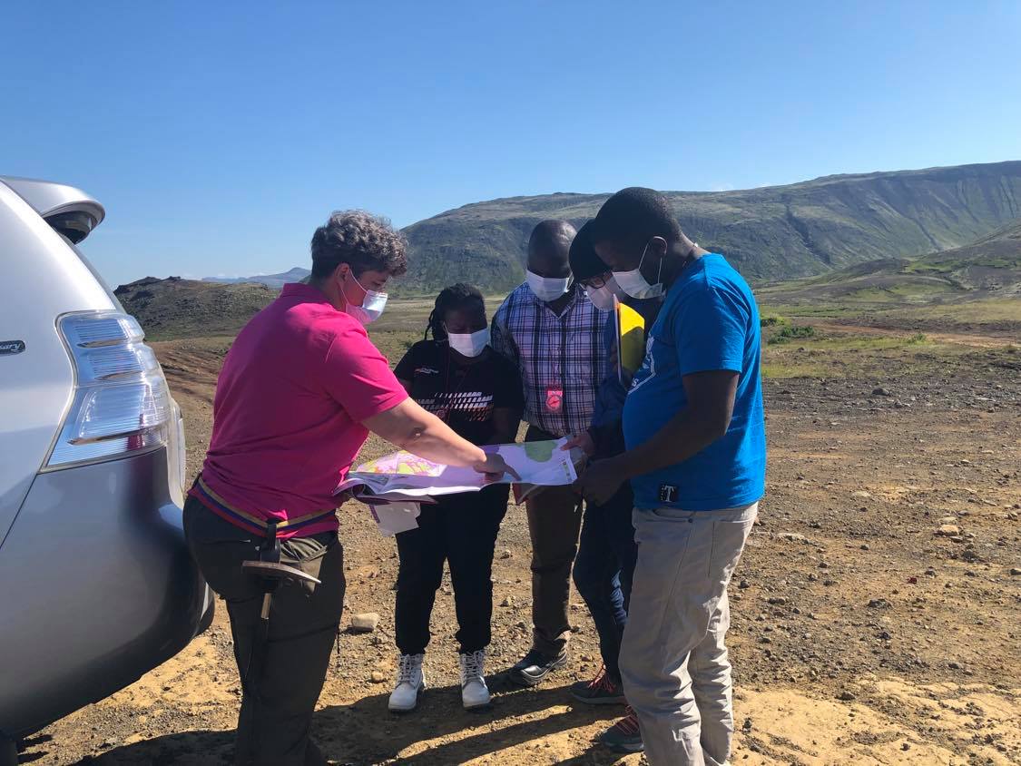 Instructor Anett Blischke explaining the geology and tectonic framework of the Reykjanes peninsula to four students from the Geothermal Training program. Photo Dr. Amy Clifton. 