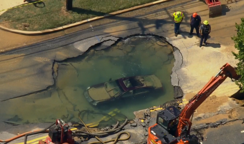 SoniaDasgupta's tweet photo. SINKHOLE: A car is fully submerged inside a sinkhole in the Upper Marlboro area of Prince George's County, Maryland: https://t.co/aOgSrtrps9 https://t.co/OAoMPxCUkq