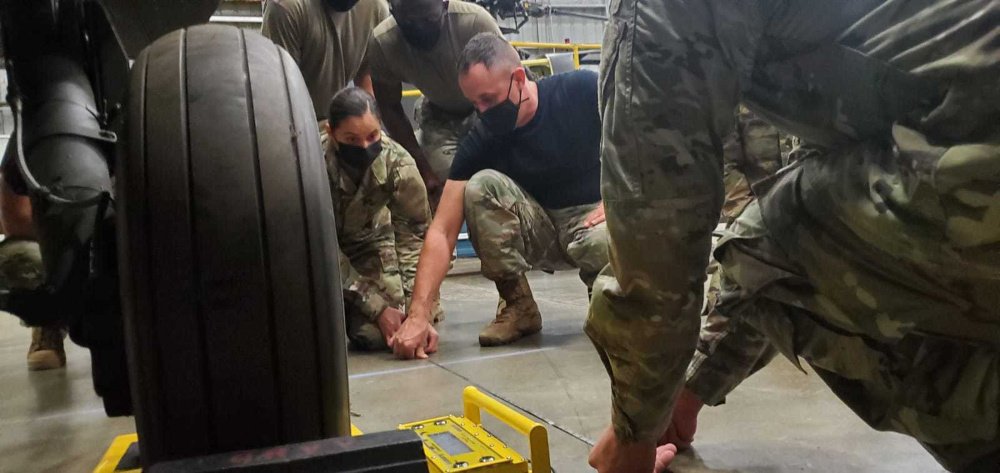 NCOAEustis's tweet photo. Students attending the ALC at the NCOA-Eustis apply knowledge they learned about weight and balance procedures by weighing different airframes found in the Army fleet at Fort Eustis.

#ThisIsMySquad 
#Forgedtolead
#USAACE https://t.co/MEZZZAWf2A