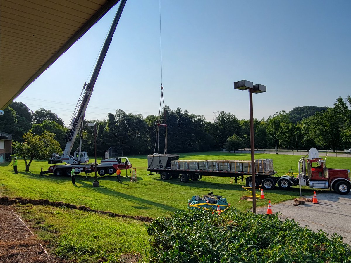 AESBulls's tweet photo. Antonia staff return to unpack in the heat, optimistically waiting for crews to install their new AC units. https://t.co/qcHUtmE6BM