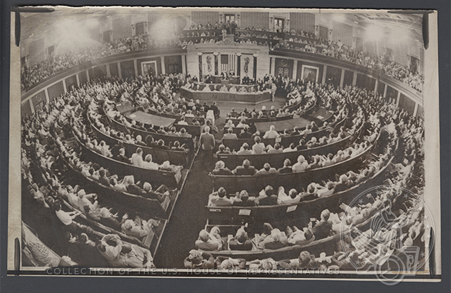 Wide-angle photograph of a crowded House Chamber