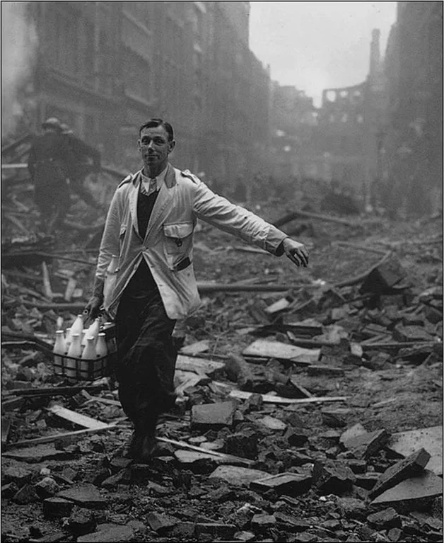 RebeccaH2030's tweet photo. The real meaning of "Keep calm and carry on”—Milkman during the London blitz, 1940.
#Tiredearth https://t.co/heE4IWA3zB