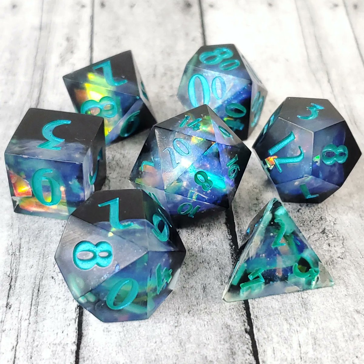 GeekMeUp_Scotty's tweet image. Aurora, a set of black and blue with iridescent cellophane. 

#dnd #dice #rpgdice #ttrpg #resindice #resincasting #handmadedice #diceaddict #dicegoblin #dicemaker #dnddice