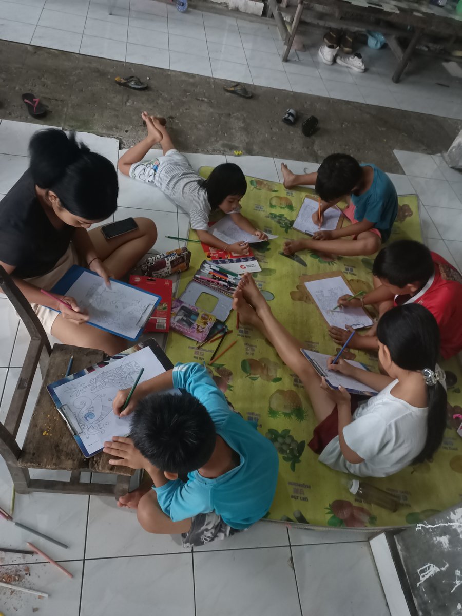 Indounik's tweet photo. It's a rainy, rainy-season-kind-of-day around Ubud, Bali. Luckily, I was able to send out a #WorldElephantDay2021 colouring challenge to a bunch of kids. Here are the Andong kids in their bubble, in their kost, just starting out on their challenge. @wrldelephantday #elevent https://t.co/S8IseBrpQW