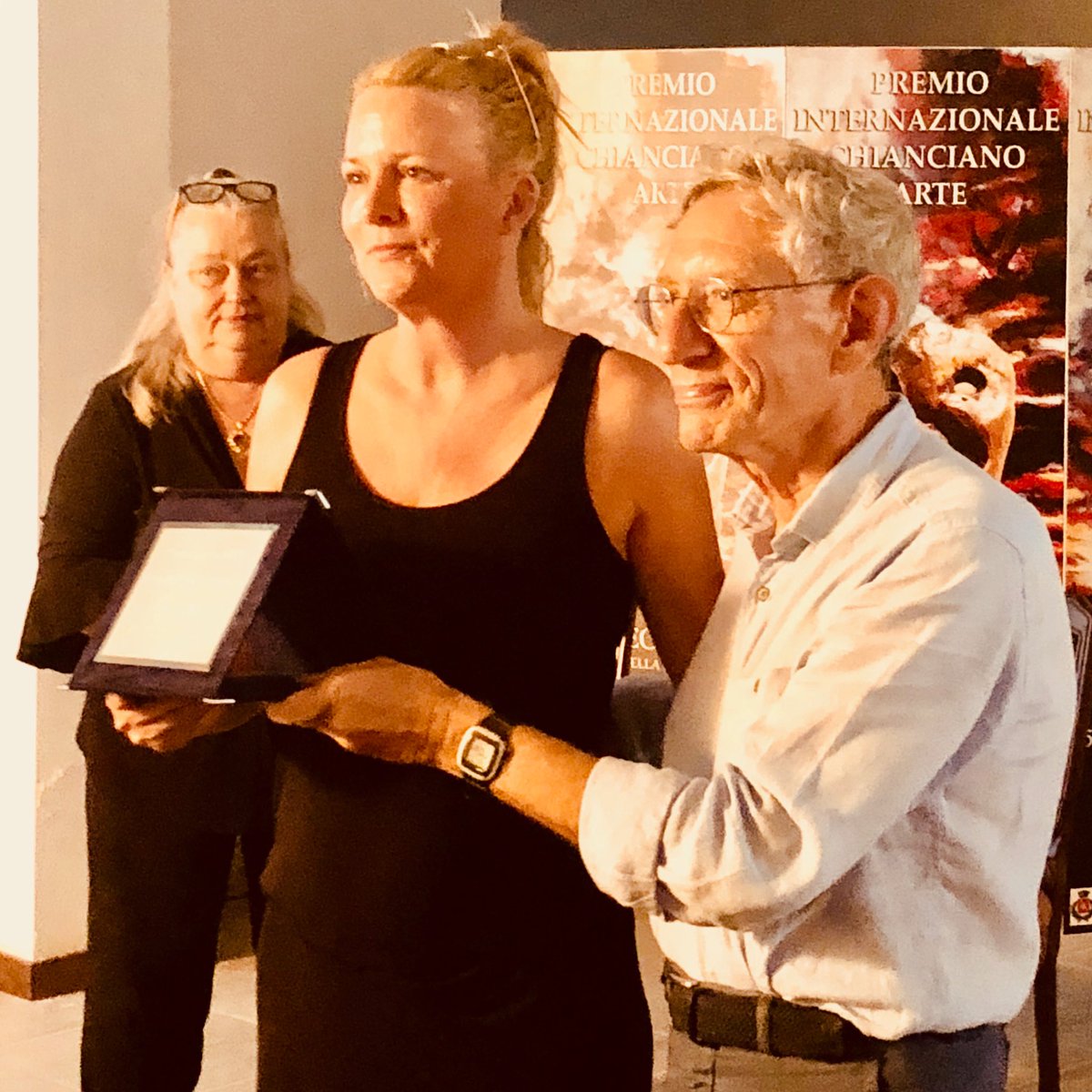 Sanagbrit's tweet photo. #TBT back in August 2018. The Chianciano Biennale! The paintings #BloodOcean and #DeathAndFlowers by @LaurelLHolloman were shown. Laurel won the 1st Place from The International Federation of Art Critics. It was a great groupshow with over 100 artists from all over the world. https://t.co/Kvb4GPlnEW