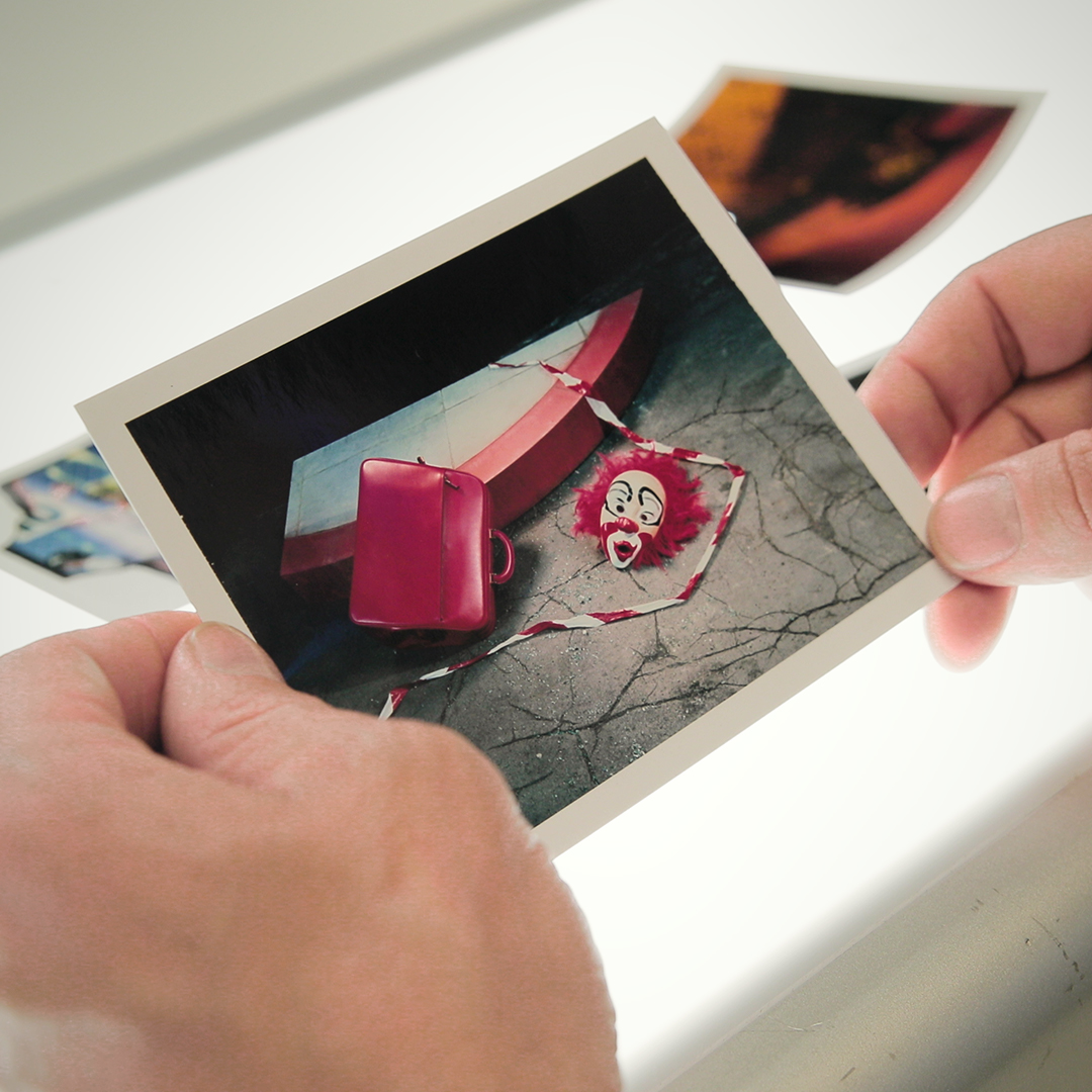 'I asked my set designer to build a corner of a road and they built this bit of pavement. It is strange seeing this Polaroid again, the weird chemical fogging and the way that the pavement appears to be floating.'⁠

- Miles Aldridge, speaking about 'The Heist - study I', 2008.