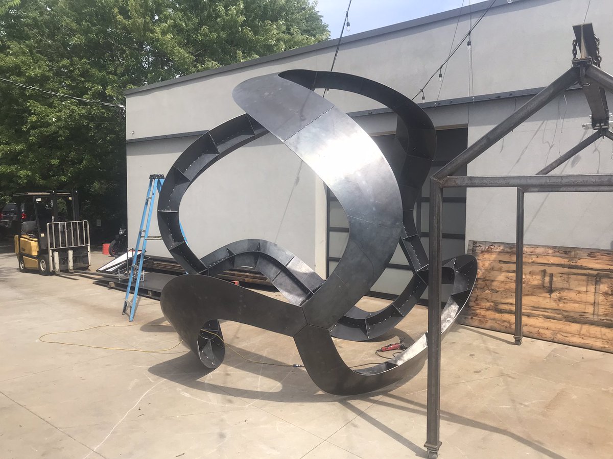 A big metal <a href="/curvahedra/">Curvahedra</a>! A 12’ ball made of steel. Cc. <a href="/UarkHonors/">UofA Honors College</a> <a href="/modusstudio/">Modus Studio</a>