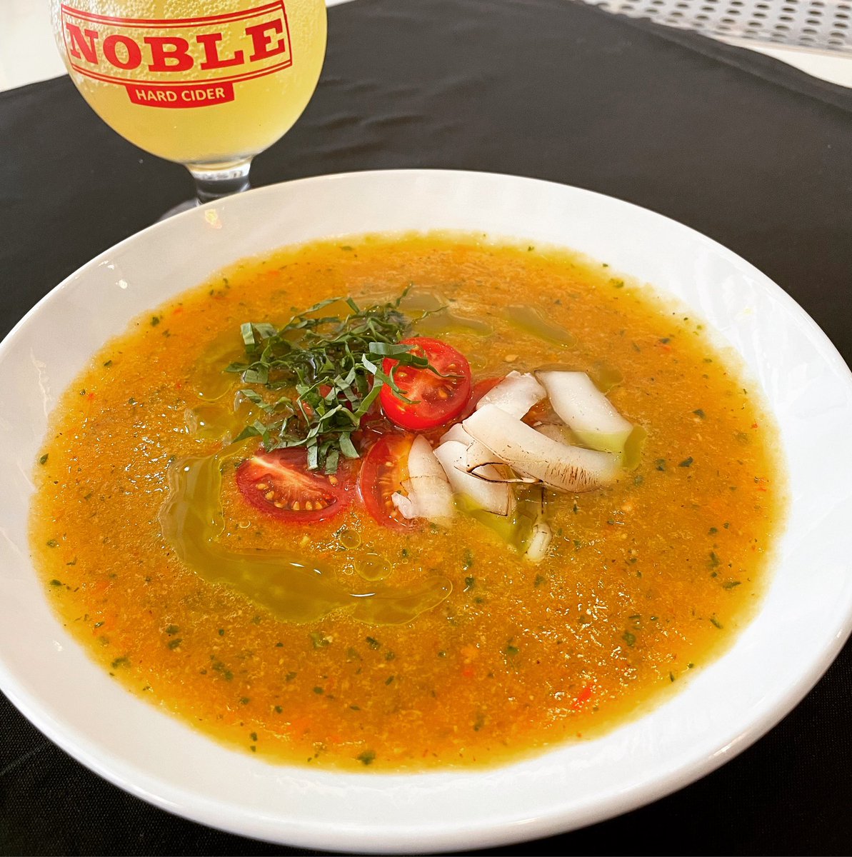 Today’s special at our Downtown AVL taproom, Thai style yellow tomato gazpacho with basil oil, heirloom tomatoes, and coconut.