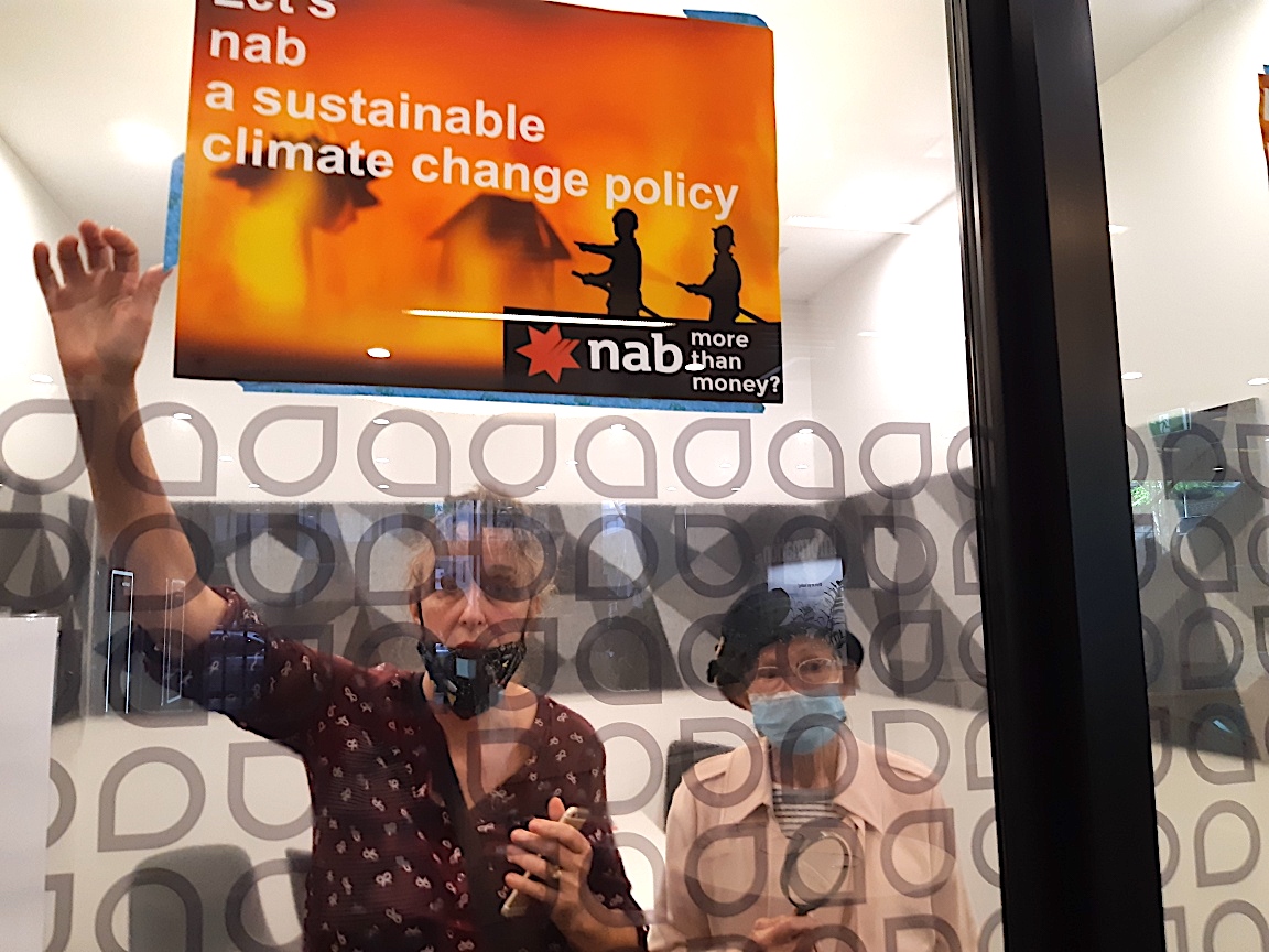 XRebellionAus's tweet photo. 💥 BREAKING 💥

Brisbane grandmothers Rae and Wendy have locked themselves inside a glass meeting room at the Queen Street NAB branch.

They're on a search and rescue to ensure NAB's draft oil and gas policy is in alignment with the recent ‘Code Red for Humanity’ IPCC report. https://t.co/eUZrBLVwxv