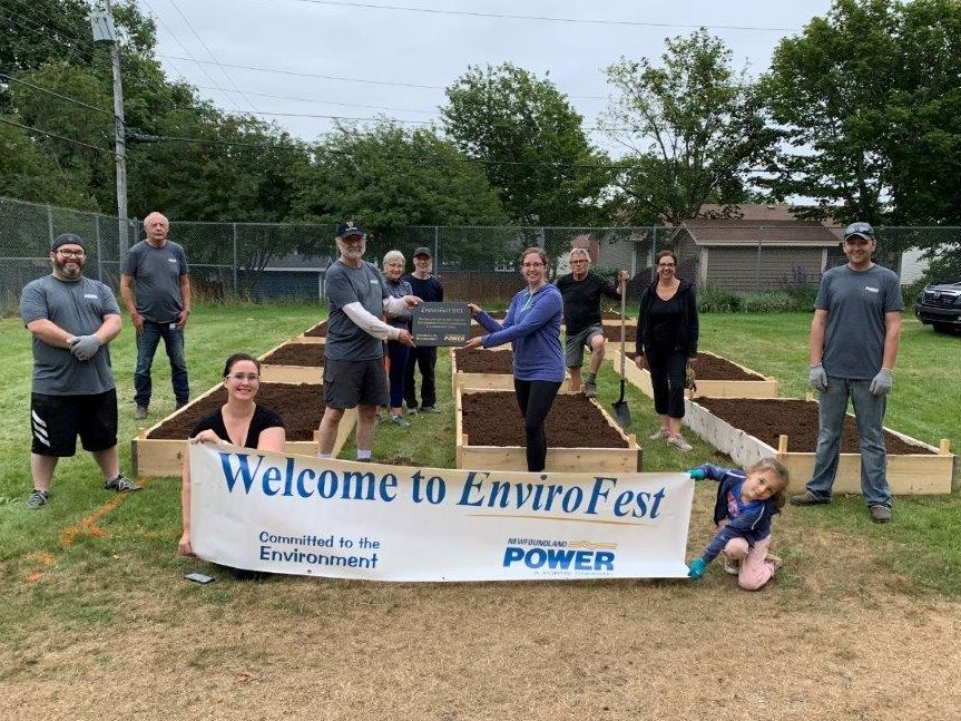 NFPower's tweet photo. We celebrated the environment at our 3rd #EnviroFest event at the East Meadows Community Garden in St. John's last evening. Employees and members of the East Meadows Garden Committee constructed and filled 16 planters that will support a sustainable food source in the community. https://t.co/wTUDbvD3b0