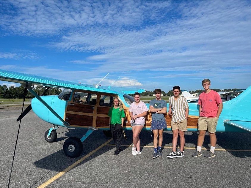 GulfShoresBOE's tweet photo. Aviation students visited the @aeroprollc hangar today where they will be building a Van’s RV-12 this year. Here they are with the Cessna 172M that Mrs. Kellogg and her husband refurbished. Swipe to see the before pic. @vansaircraftinc #makewaves #aviation #tangoflight https://t.co/acFkP5XTtg