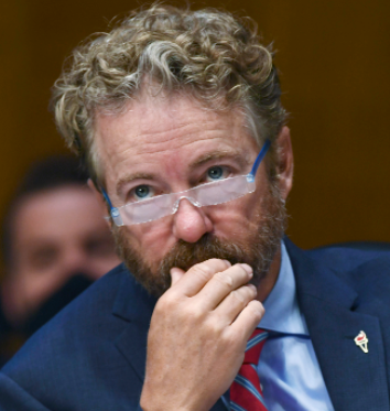 A prematurely bald FOX News enthusiast strides confidently into Wig Masters. "Fredo?! I'm finally ready! Give me the Rand Paul!"