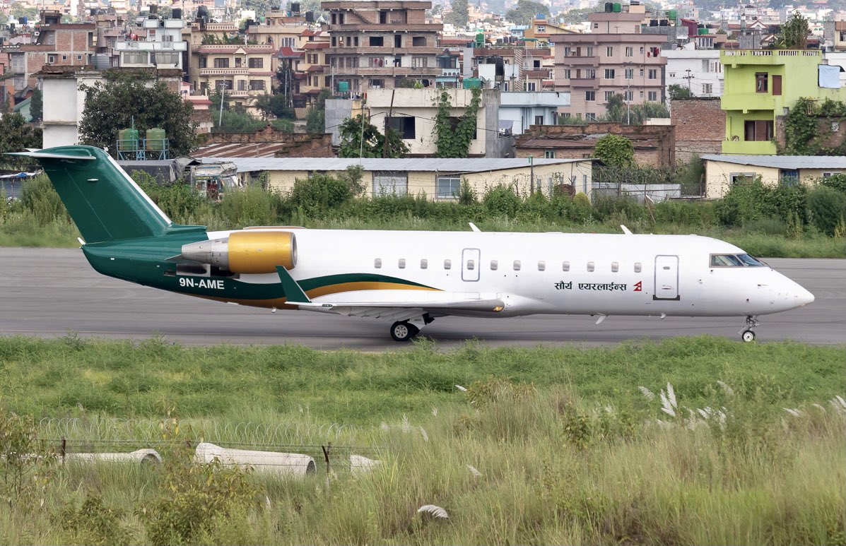 NepalAviation's tweet photo. βRedβ turns βGreenβ. Saurya Airlines, Bombardier CRJ-200ER on the new livery at Kathmandu Airport. Photo Courtesy- Ktmspotter #sauryaairlines #9NAME #crj200 #bombardier #vnkt #aviationnepal https://t.co/oi6gRYSfAy