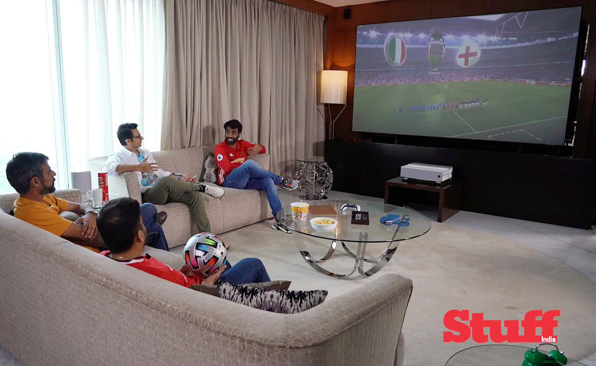 stuff_india's tweet photo. BenQ V6000 is the perfect replacement for your old TV. 3000 ANSI Lumens brightness, latest Apple TV, premium design & treVolo soundbar completes the package. Watch the Stuff team host a watch party at home https://t.co/JX7domQouq #TVreplacement #4kprojector #lasertv #benqindia https://t.co/ugG4Yn2CuZ