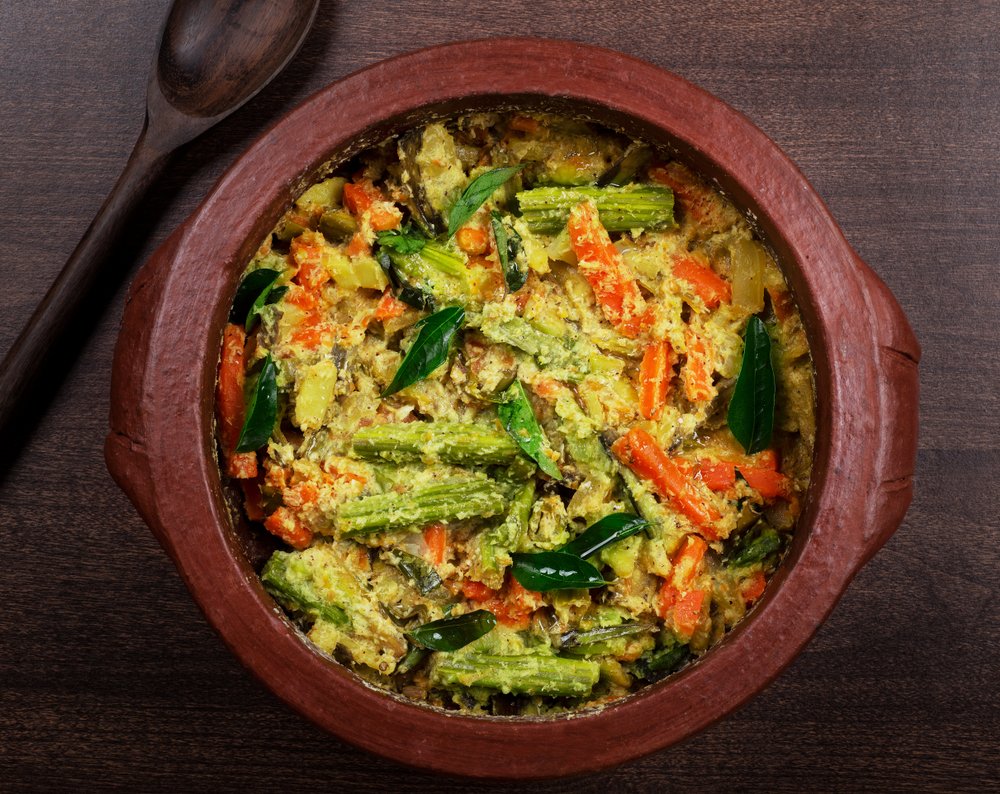 KeralaTourism's tweet photo. A medley of fresh vegetables gently caressed with a creamy coconut and yoghurt gravy, the avial is what makes the sadya complete. #Onam2021 #KeralaTourism https://t.co/ujRvnKqNQi