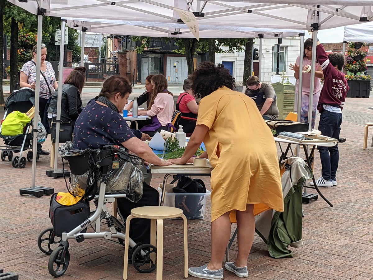 the_turnpike's tweet photo. Our community garden day is well underway! Come along to Civic Square Leigh for plants, art, cake and a peek at the installation These Lancashire Women are witches in politics. We're here until 4pm 🌞 #Wanderland @Lancswildlife @WiganCouncil https://t.co/AaG9yIZY0x