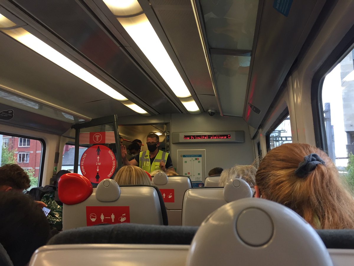 Lauramraymond's tweet photo. Photo doesn’t do packed train justice ! D’iawn ⁦@tfwrail⁩ cancelled the only direct train from south to north on a BH Friday then put only  two carriages on the next #6hour journey now ! ⁦@MarkDrakeford⁩ ⁦@DarrenMillarMS⁩ #forgottennorth #northwho #notcovidsafe https://t.co/K4YhegPQkE