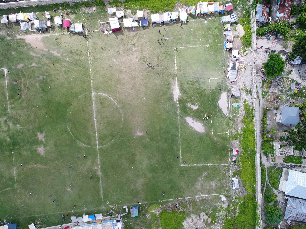 JosiahThomas7's tweet photo. Some individual #drone pics from #cavaillon #haiti. These are some of the most obviously damaged areas, but we've identified about 60 spots that seem to be damaged. The field is where quite a few ppl are currently living in makeshift tents.

#earthquake @ADFHaiti #dronesforgood https://t.co/3YkbYe6MjZ