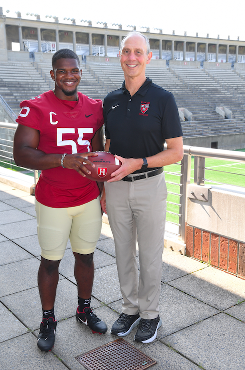 HarvardFootball's tweet photo. Coach Murphy and ‘21 Captain Jordan Hill couldn’t be more excited for the season. Media Day means one day closer!

#GoCrimson https://t.co/xakYBNNUxN