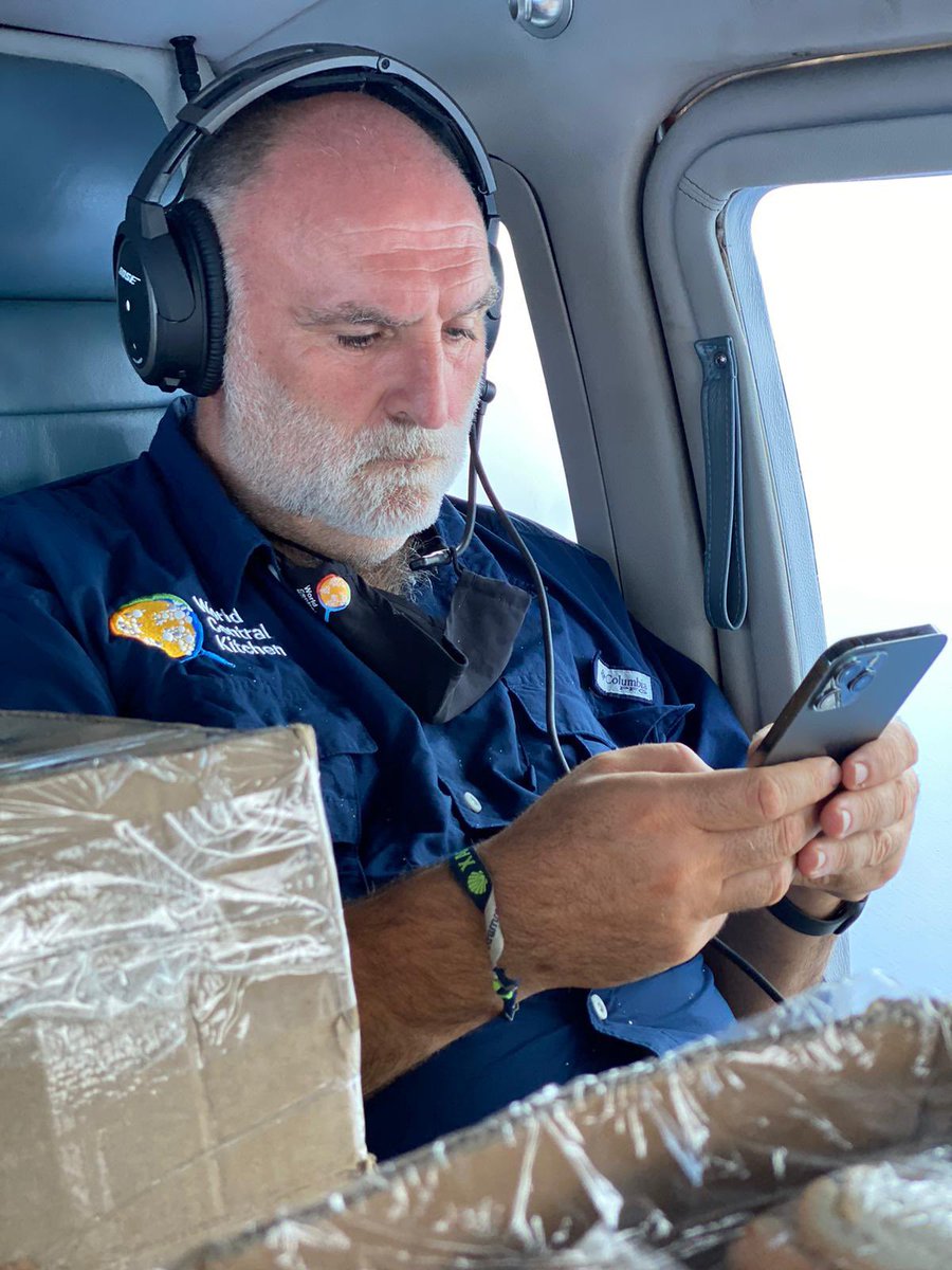 natemook's tweet photo. “Never leave empty space when people are hungry.” — @chefjoseandres on a helicopter filled with sandwiches as @WCKitchen visits isolated communities in Haiti following the earthquake. He’s on his phone putting in GPS coordinates so the WCK team knows where to return tomorrow. https://t.co/IGB2Xf7ORs