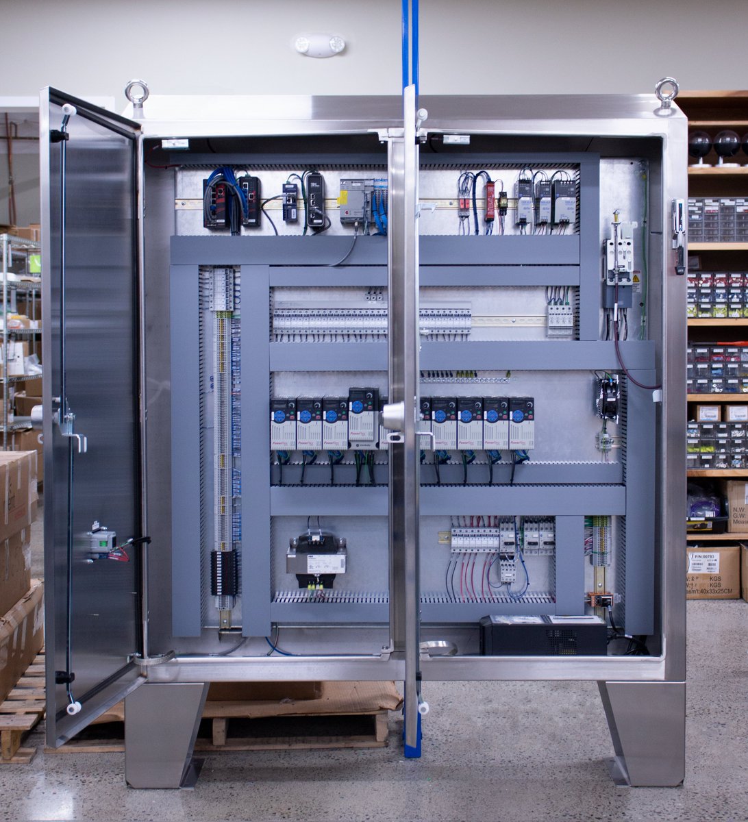 We recently concluded work on this panel that will be used by a client in the food processing industry to operate a product conveying system. 

The panel is housed in a NEMA 4X watershed style enclosure and includes (10) VFDs, a PLC rack, &amp; (2) managed Ethernet switches.