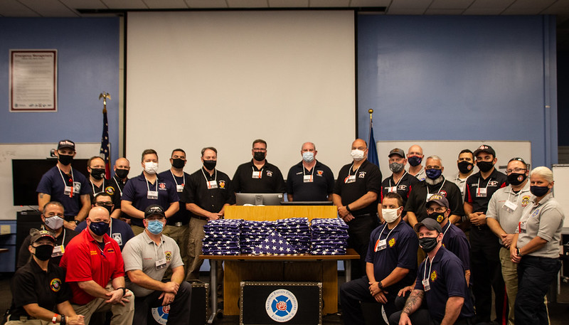 NFFF_News's tweet photo. Thank you to the representatives from 13 agencies for respectfully and honorably folding the flags which will be presented to families during October's Memorial Service. #firehero https://t.co/WpXf1IWUuy