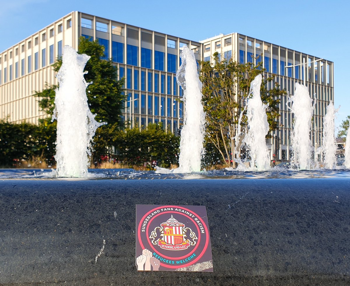 SteMartPhotos's tweet photo. A few stickers around the city centre today. I argued with a bloke near me over his childish booing of the knee, he took offence to me clapping. Most around me backed me up and hearing the cheers drown out the minority booing was great 👍 

@SunderlandUnite 
@Safc_FLAF https://t.co/bsGRfUZvlU