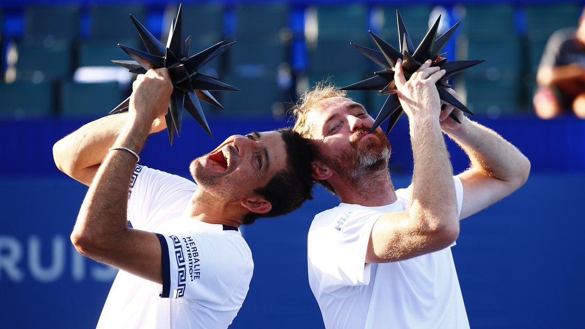 WSOpen's tweet photo. We love our champions with personality! 🤪 

Congrats again to @CheloArevaloATP and @Mside83 - our newly minted doubles champions!  🏆 

--
#wsopen | #builtforthefans | #builtforwinstonsalem https://t.co/yEzrCphVSf