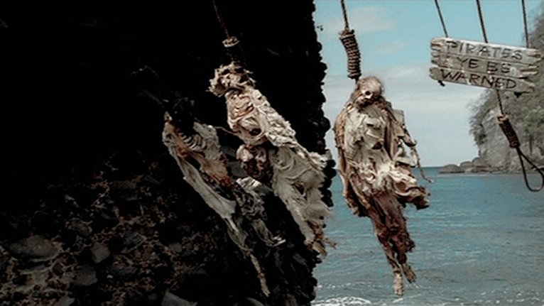 вешать пиратов. пираты карибского моря 1 виселица. джек воробей повешенные пираты. пираты карибского моря 1 виселица. пираты карибского моря повешение.