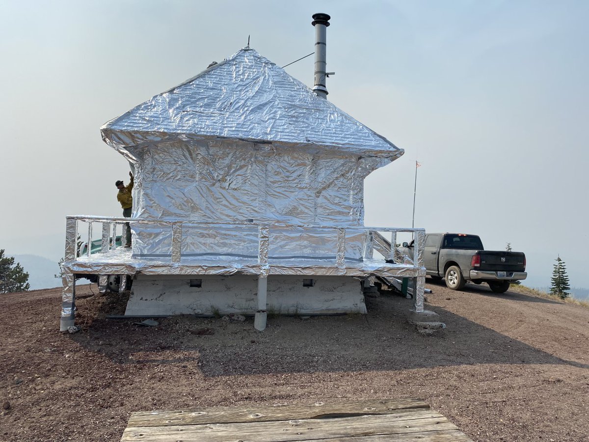 Klamath_NF's tweet image. Fire crews protect values at risk in many ways. In these photos crews are utilizing structure wrap and sprinklers to protect structures in the path of the #AntelopeFire.