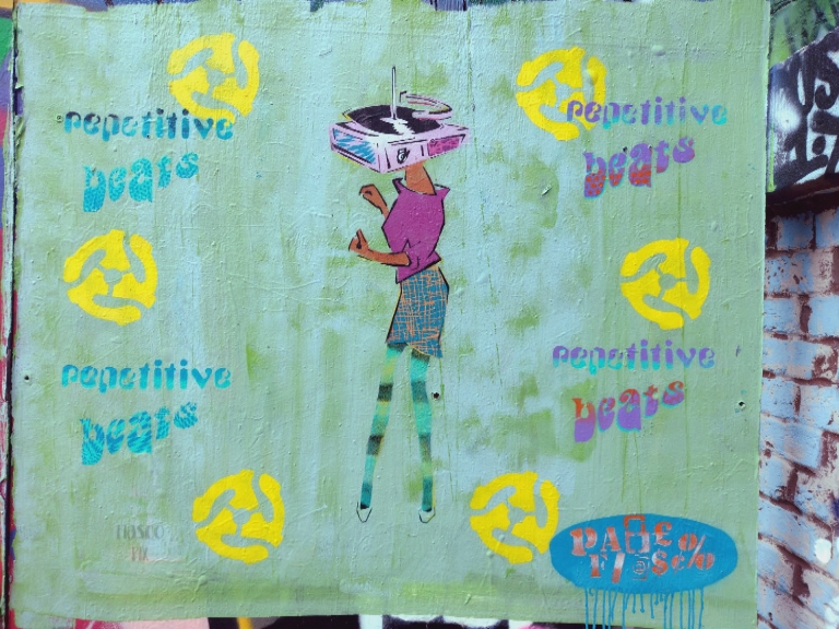 spraymynamespr1's tweet photo. Stencil collage with repetitive beats and a woman with a  turntable head in Brick Lane, London #repetitivebeats #stencil #graffiti #streetart #bricklane #bricklanegraffiti #londonstreetart #bricklanestreetart #collage #turntable #charactergraffiti https://t.co/tHMuOWQ7cS