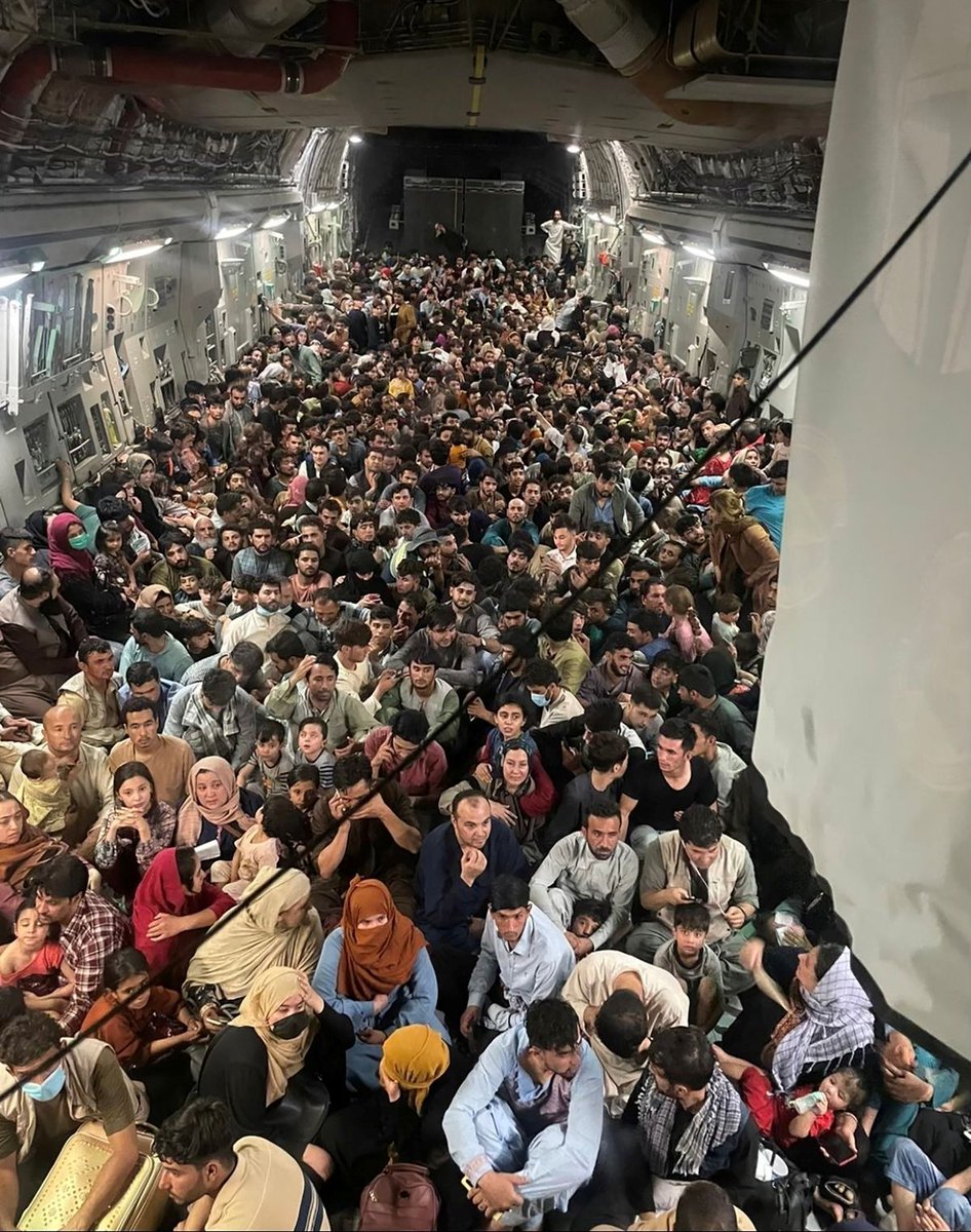 Reuters's tweet photo. More than 600 Afghan men, women and children, crouching and crammed up against each other on the floor of a U.S. military plane, left Kabul after the city was seized by Taliban insurgents https://t.co/gHjQHq7K6A https://t.co/FIEU4gE2jB