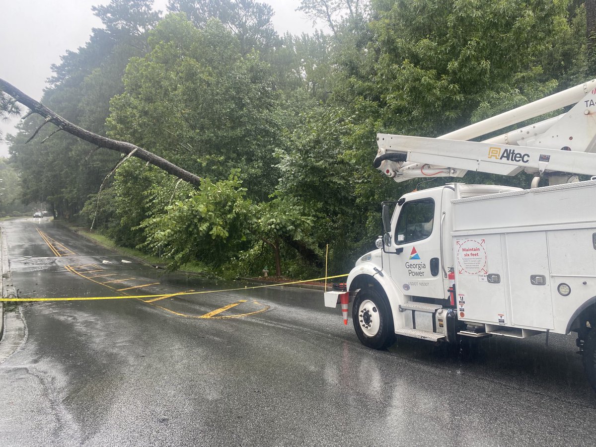 Fallen tree knocks down power lines near Oglethorpe University in DeKalb County. University briefly lost power. But nearby homes, apartments and businesses, including Costco, still in the dark.