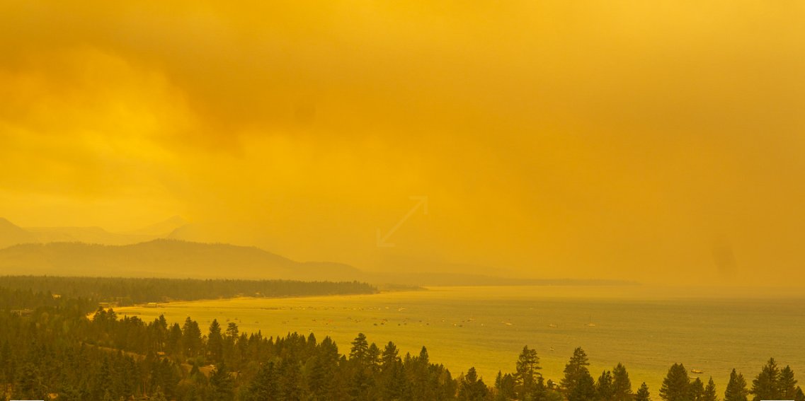 MarcusHylton's tweet photo. Lake Tahoe webcam is looking a tad apocalyptic. 7am vs  now. Smoke from the Caldor Fire https://t.co/vbZQXJHKsB