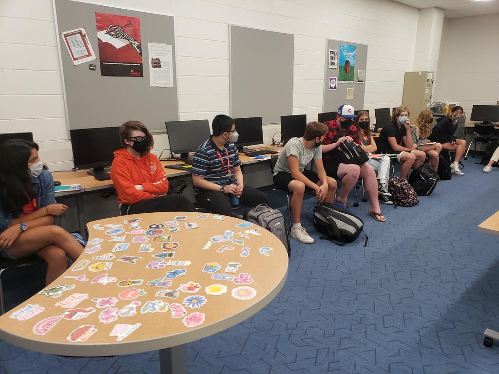 CaroWags's tweet photo. We had such a fun time with this icebreaker! Everyone chose a sticker (who doesn't love stickers?) and each person introduced him/herself and explained how the sticker inspired them for the year ahead or evoked a memory. Lots of laughs and smiles! #LZHSFirstDay #WeAreLZ https://t.co/Jn1f2bPzBi