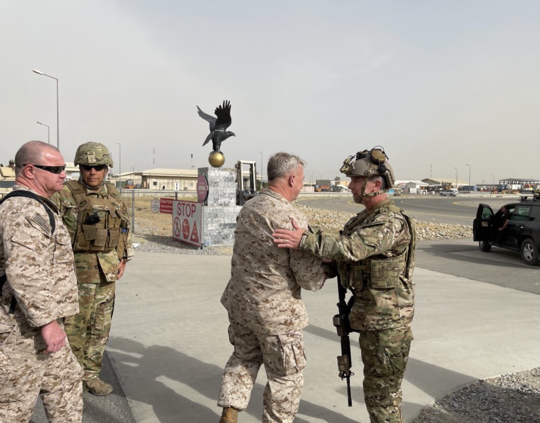 I meets with Navy Rear Adm. Peter Vasely, U.S. Forces Afghanistan-Forward commander, at Hamid Karzai International Airport in Afghanistan.