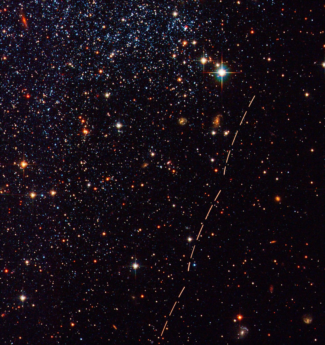 NASAHubble's tweet image. ...what was that? 😳
 
The “trail” in this image, taken by Hubble #OTD in 2003, is actually an asteroid that drifted across the field of view!
 
Learn more here: go.nasa.gov/37Rio7N