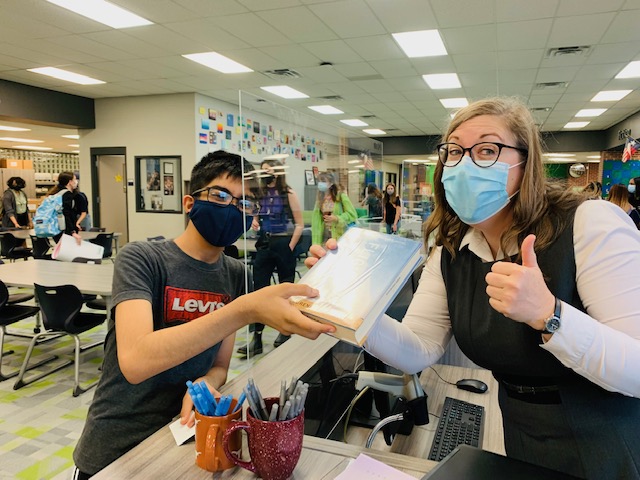 McNeilHSLibrary's tweet photo. First checkout of 2021-22 school year-  welcome back Mavs! @RoundRockISD @LibrariesRRock @MHSMavs https://t.co/cVCsxx9aqL