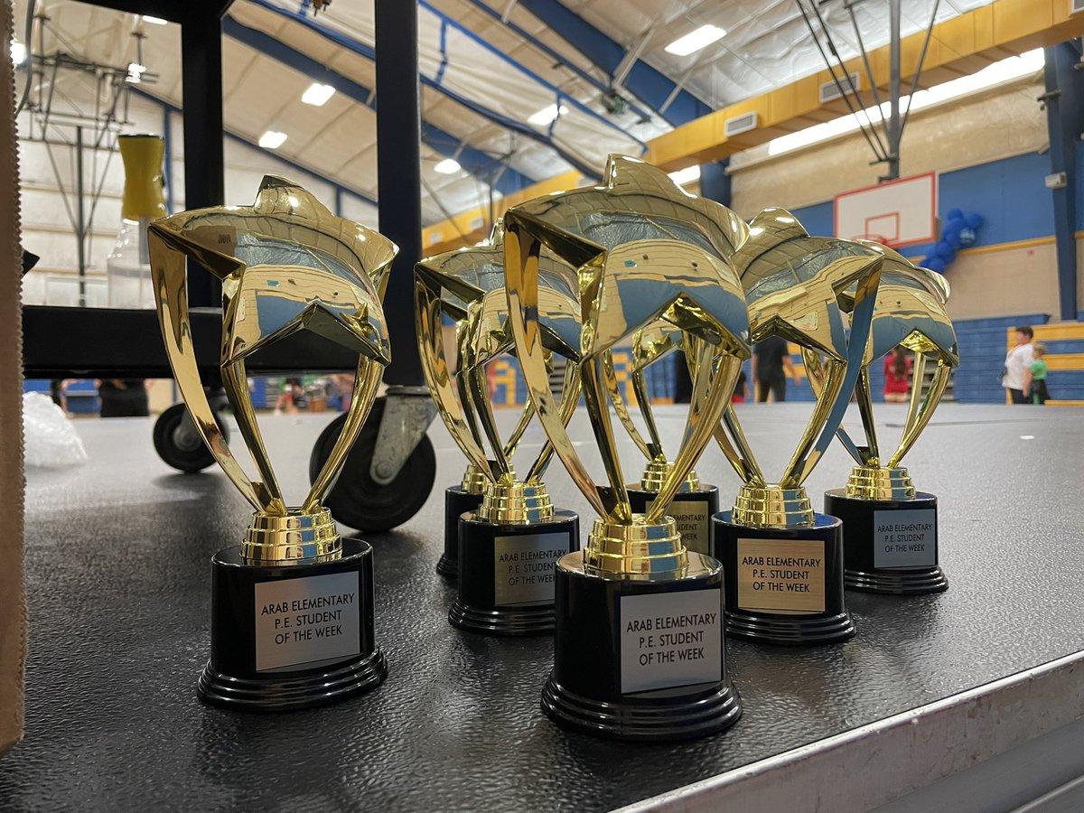 EmilyStapler's tweet photo. Each Friday we will announce a PE Student of the Week! The trophy will be displayed in the student’s classroom for the week, and they will earn a point for their house!!           🖤❤️💚💙 https://t.co/M5AHfXk00N
